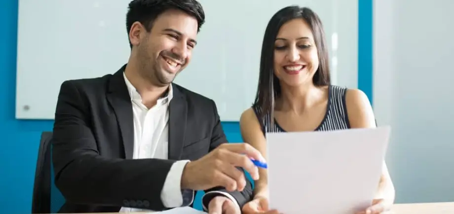 Young couple signing prenup documents